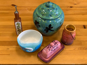 Olive oil dispenser, yarn bowl, butter dish, star jar lantern and cookie jar. 